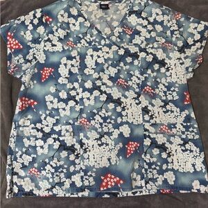 Women’s Blue Floral V-Neck Scrub Top with Red Origami Accent